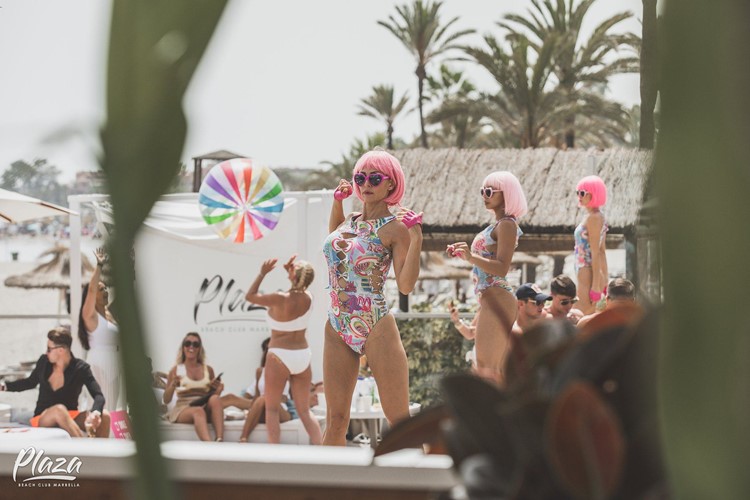 Plaza Beach club Marbella dancers on stage dance show event party go out today book your own vip table reserve now alcohol bottles