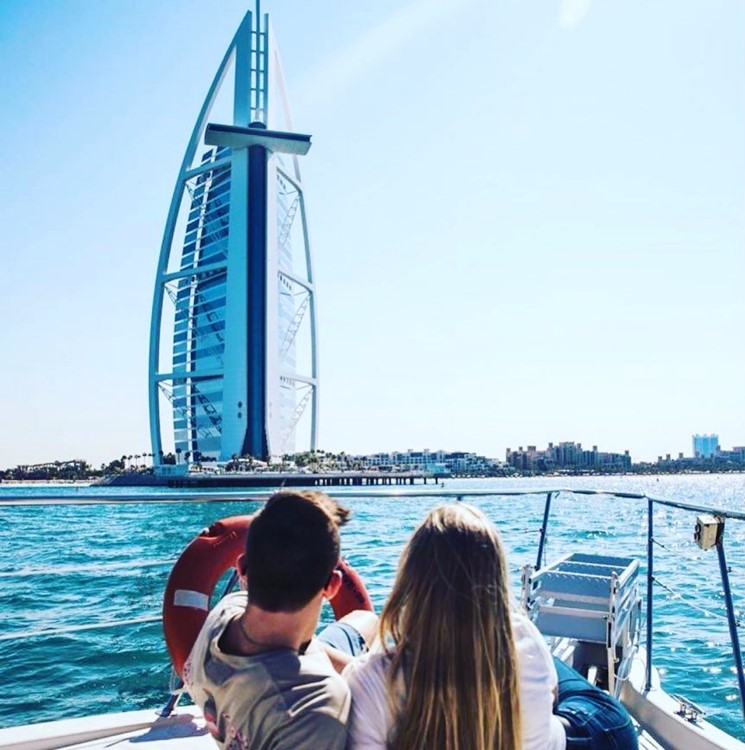 Private boat party Dubai yacht couple friends crowd rent fun