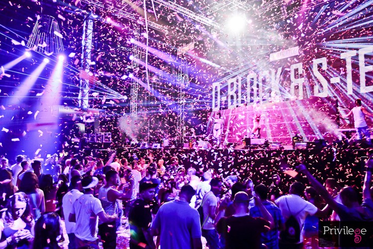 Privilege nightclub Ibiza crowd having fun at event confetti 