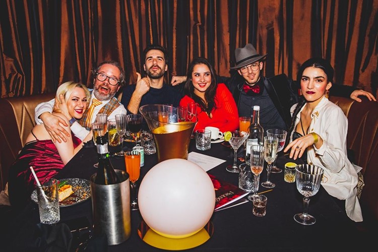 Proud Embankment nightclub London people celebrating partying vip table booking reservation champagne bottles vodka drinks cocktails 