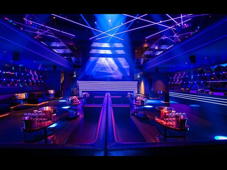 Prysm nightclub Chicago lounge area vip table alcohol bottles