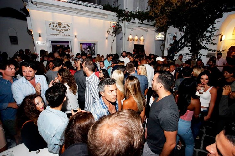Queen of Mykonos nightclub club's exterior crowd having fun