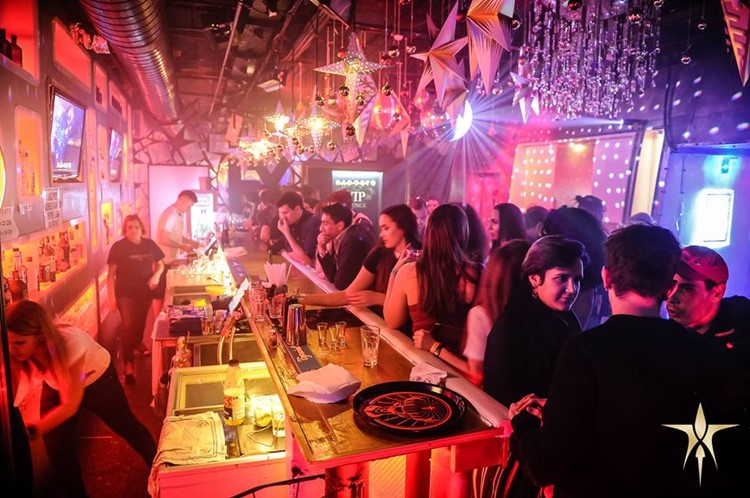 Radost FX nightclub Prague bar view clubstaurant food drinks alcohol cocktails lights show people chatting