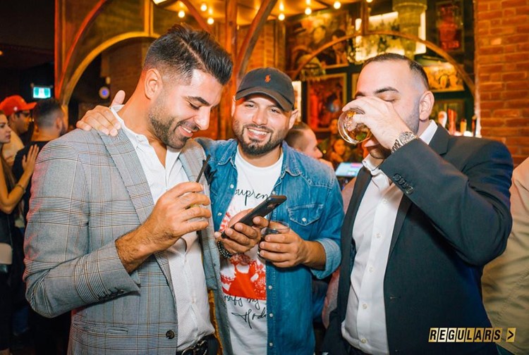 Regulars Bar club Toronto hot men drinking alcohol expensive champagne