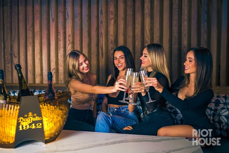 Riot House club in Arizona pretty girlsl having fun drinks food bubbles