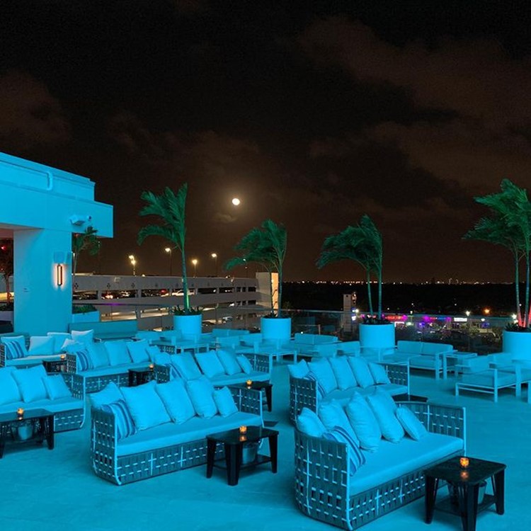 Rooftop Live club Miami night view couch vip table seating