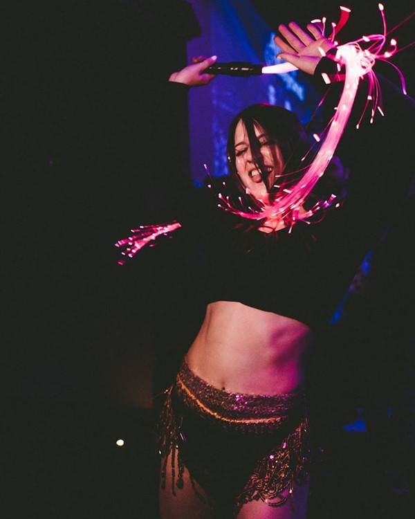 Schimanski New York club exotic dancer dancing with lights show black skirt costume