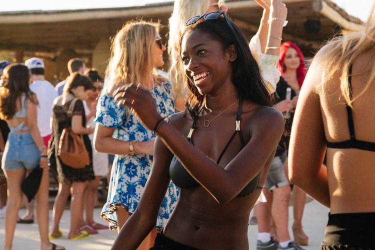 Scorpios beach club Mykonos pretty girl in bikini dancing fun party 