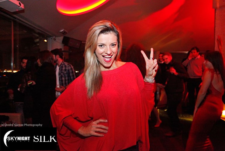 Silk Club nightclub Lisbon pretty blonde girl in red dress having fun