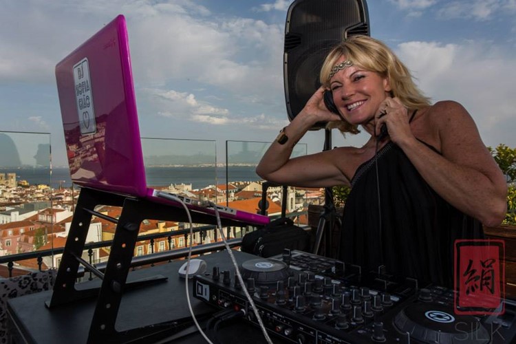Silk Club nightclub Lisbon blonde dj girl having fun mixing music