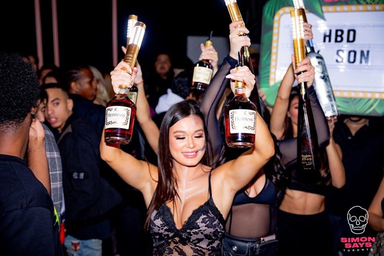 Simon Says nightclub Toronto waitresses parade champagne bubbles fun party celebrate