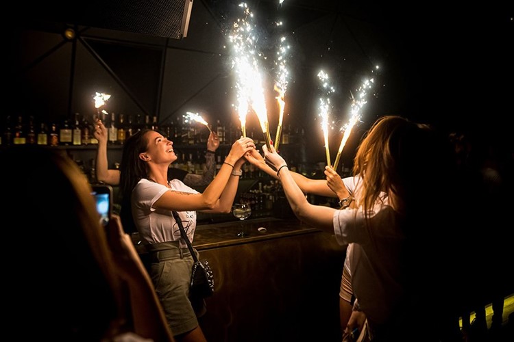 SkyBar nightclub Kiev girls celebrating having fun book your own table reserve now vip area alcohol bottles celebrate all night