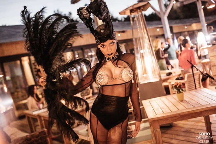 Soho Country Club Moscow sexy exotic dancer in black costume lingerie cleavage feathers