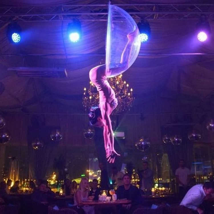 Soho Rooms nightclub Moscow exotic dancer acrobat hanging from the ceiling in ring