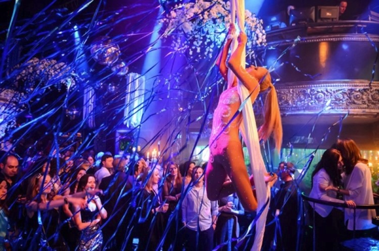 Soho Rooms nightclub Moscow dancer hanging from white ropes