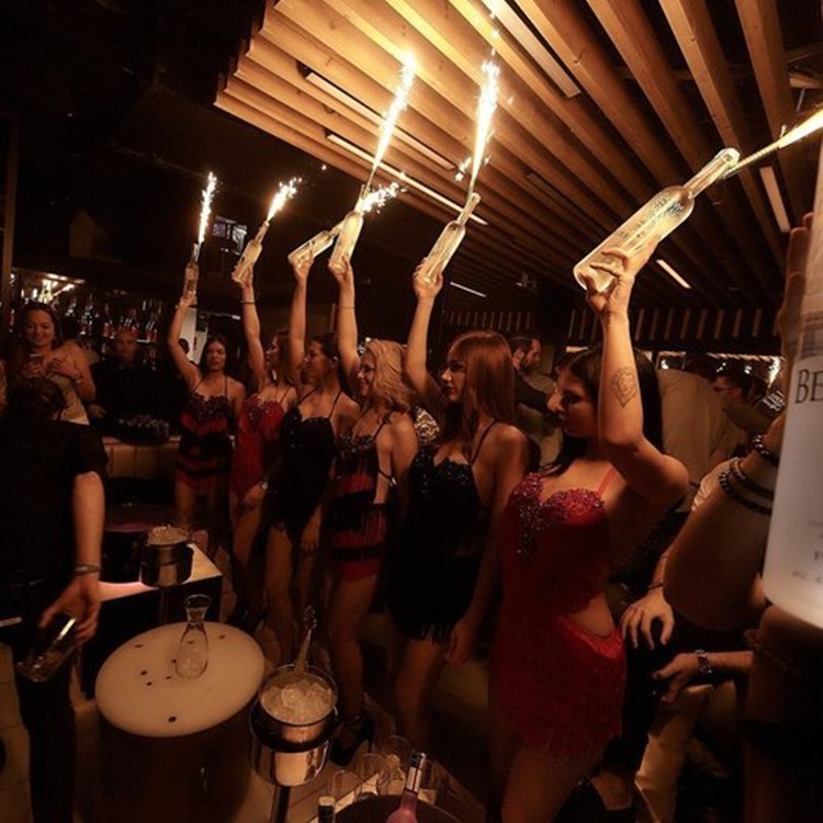 Soho Rooms nightclub Moscow sexy women holding alcohol champagne bottles table bookings service