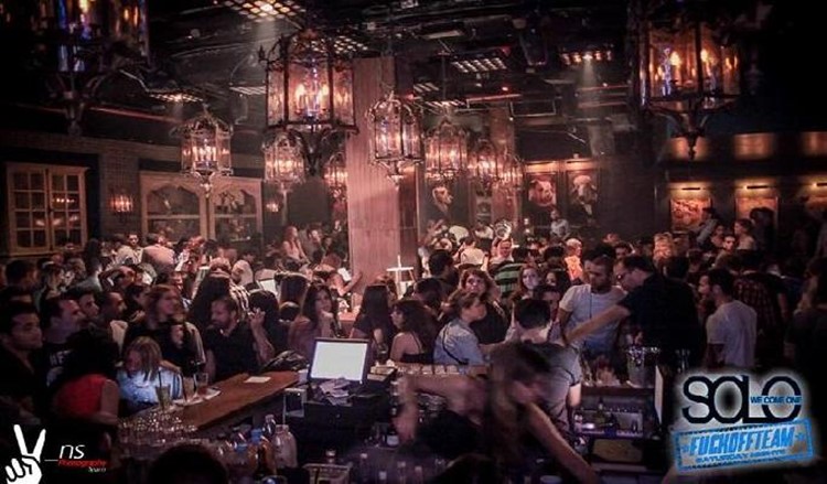 Solo Club nightclub Tel Aviv view of the full club crowd having fun chandeliers