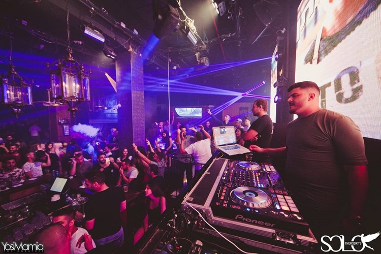 Solo Club nightclub Tel Aviv dj mixing music having fun crowd dancing