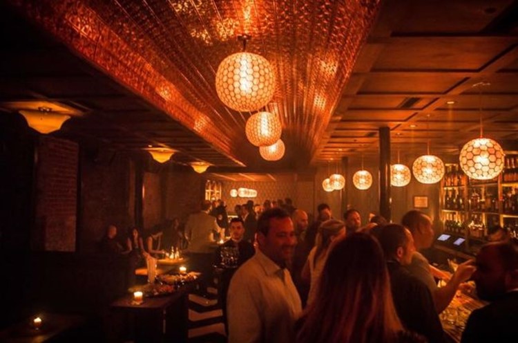 Somwhr Liquor Lounge nightclub Montreal view of the bar area people socialising and drinking