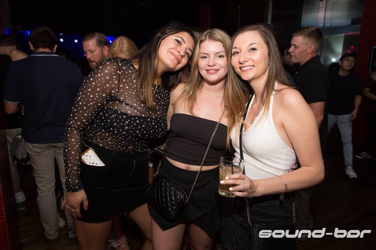 Sound Bar nightclub Chicago three girls having fun drinking