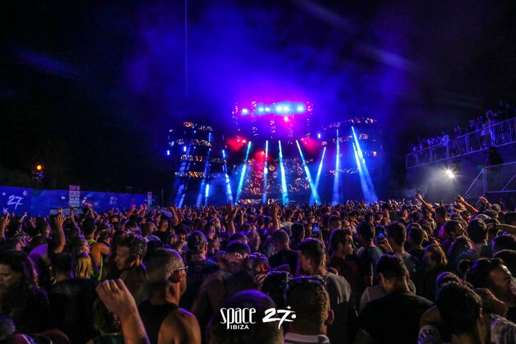 Space nightclub Ibiza crowd at big party show lights effects