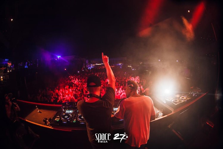 Space nightclub Ibiza two djs mixing playing music big crowd