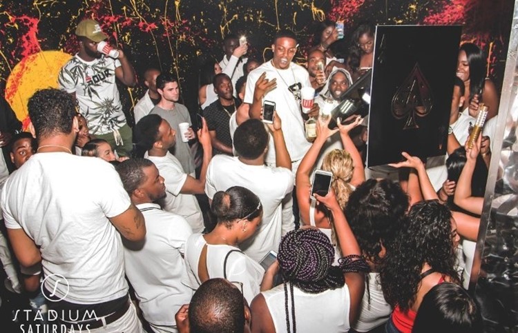 Stadium nightclub Toronto crowd dressed in white at party concert