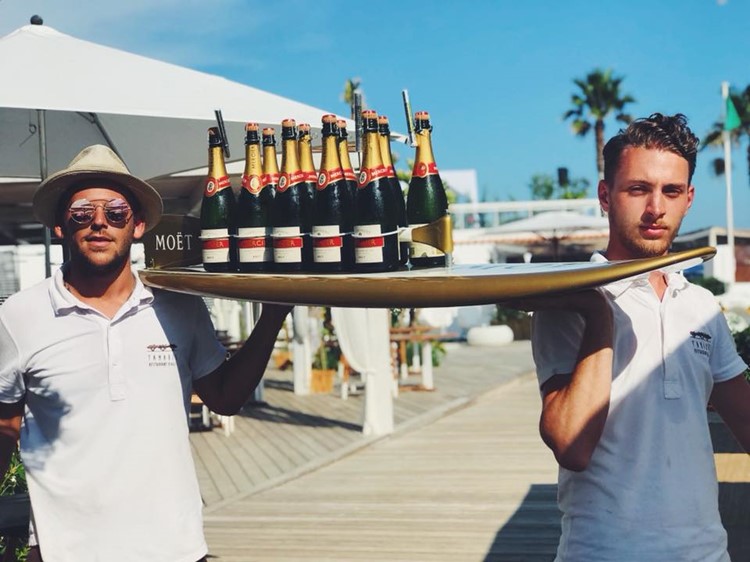 Tamaris beach club Cannes alcohol bottles expensive champagne celebrate fun parties