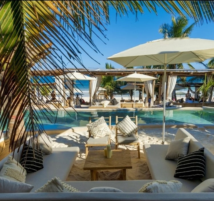 Tantra beach club Tulum swimming pool fun event venue palm trees tropical