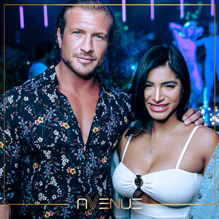 The Avenue club in Dubai couple handsome guy brunette girl go out have fun nightout