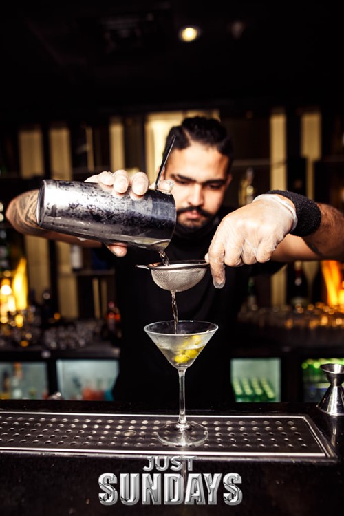 The Avenue club in Dubai cocktails barman mix alcohol bottles drinks