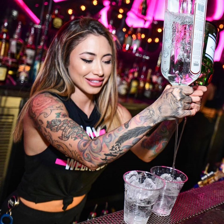 The Light nightclub Las Vegas pretty girl waitress bartender pouring drinks alcohol fun party clubbing