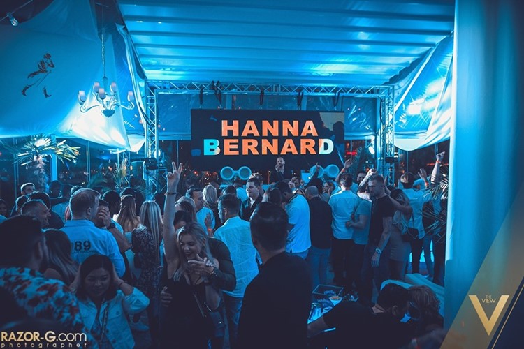 The View nightclub Warsaw crowd partying having fun dancing on the dance floor dj mixing music event go to tonight