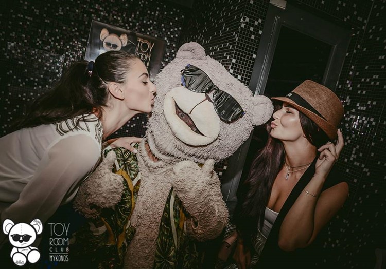 Toy RoOm nightclub Mykonos pretty brunette girls kissing mascot teddy bear