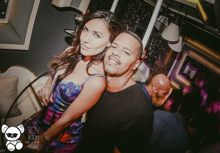 Toy RoOm nightclub Mykonos pretty brunette green eyes woman with a boy friend having fun