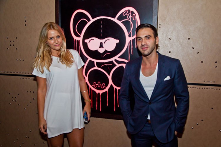 Toy Room nightclub Dubai beautiful blonde woman and brunette man next to teddy bear image