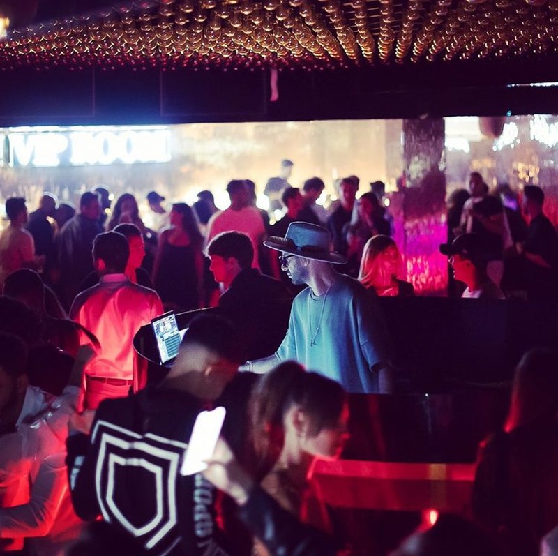 vip room st tropez nightclub drunk couple having fun at a party grey hair man with pretty brunette blue eyed woman