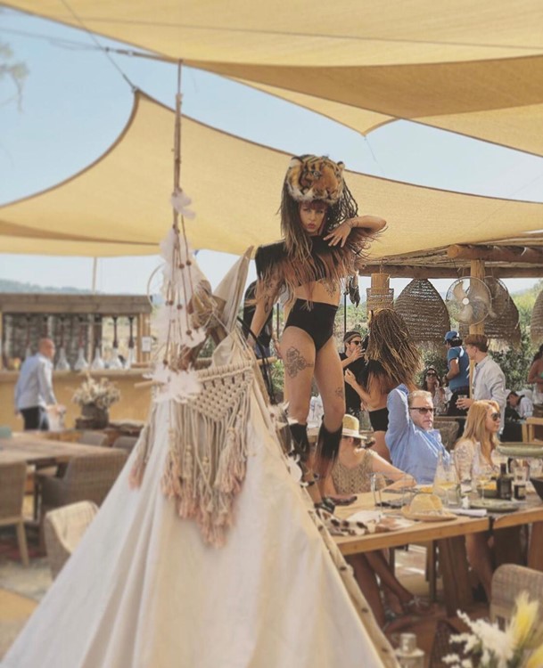 Verde Beach club St Tropez exotic dancer on table dancing pole dance costume bikinis tribal outfit