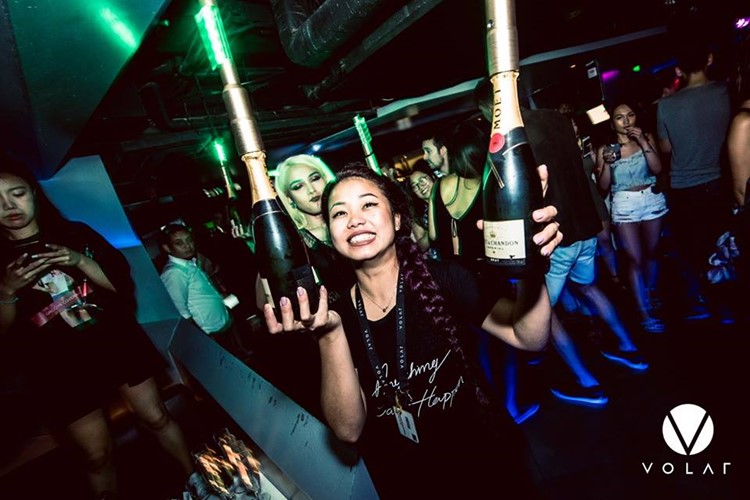 Volar nightclub Hong Kong pretty chinese waitress holding big champagne bottles