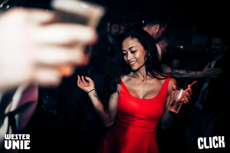 WesterUnie nightclub Amsterdam pretty brunette girl dancing in sexy red dress