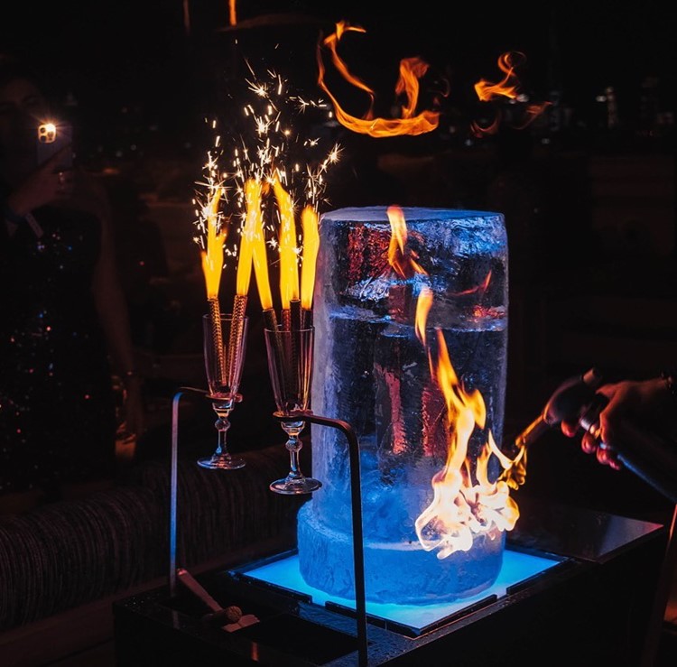 White Dubai nightclub alcohol bottle book vip table