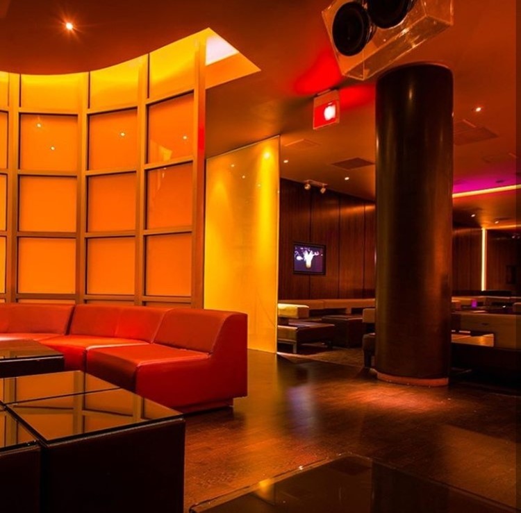 Ybar nightclub Chicago lounge area bright lights brown interior design