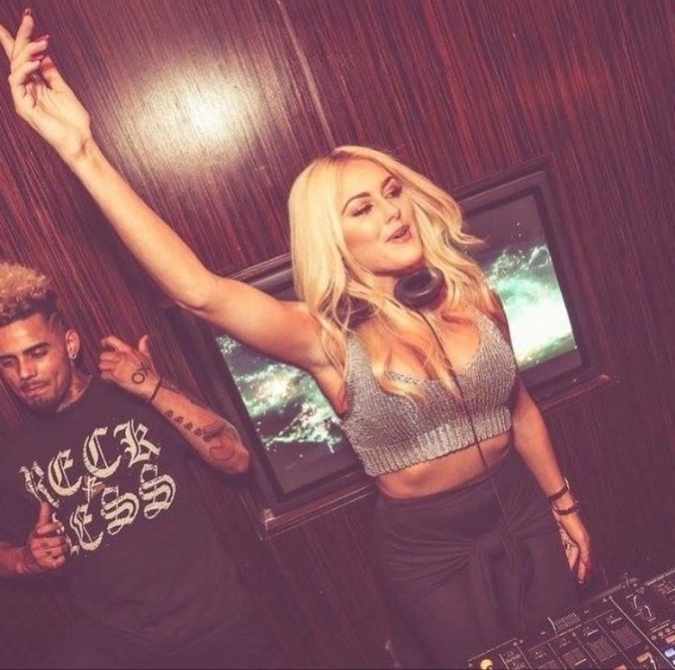 Ybar nightclub Chicago sexy blonde dj girl dressed in mini skirt